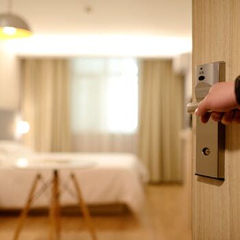 pexels-photo-271639-271639 A soft-lit hotel room entrance, welcoming guests with luxury appeal and comfort.